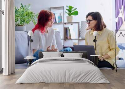 Therapy session for teenage girl, psychologist and patient together in office Wall mural