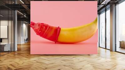 red condom and a banana Wall mural