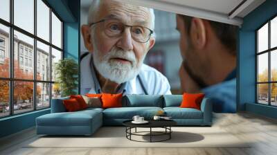 A senior gray-haired doctor in hospital tells shocking news to a patient. Doctors telling man the diagnosis disease serious bad news Wall mural