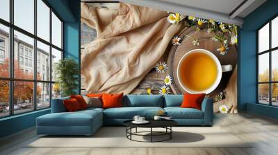 A wooden table with a cloth and a bouquet of chamomile flowers Wall mural