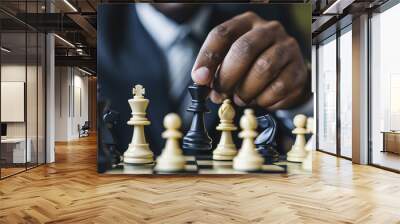 African-American hand of businessman wearing suit moving chess figure in competition success play. strategy teamwork management or leadership concept. Wall mural