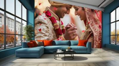 Celebration of special day of love marriage ceremony concept. Indian wedding. Groom dressed in white Sherwani with stunning bride in lehenga during the Saptapadi ceremony on Hindu spousal Wall mural