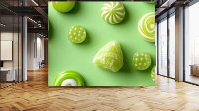 Fun lime green background with happy candy designs Wall mural