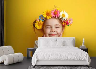 Happy girl with a wreath of colorful beautiful flowers on her head. Spring sale, holidays, portrait of a happy person on yellow studio background concept Wall mural