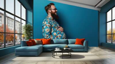 Happy pregnant transexual man with beard expectant trans father on blue background. Celebrating diversity in parenthood pregnant man gender norms expanding the definition of family concept. Copy paste Wall mural