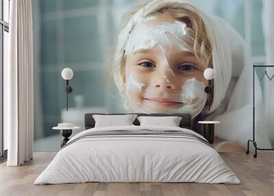 Kid applies cream on face in bathroom, skincare routine. Wall mural