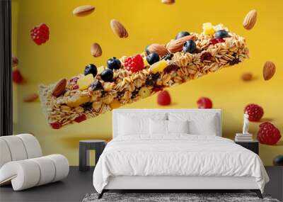 Protein granola cereal vegan bar on yellow background with puts levitating around. Healthy workout snacks Wall mural