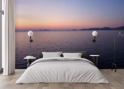 In crimson tones, or arrival to the island of Corsica late spring evening. Wall mural