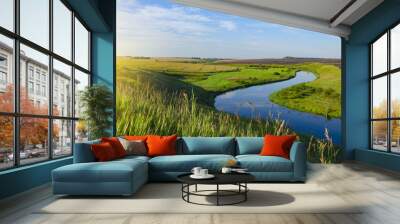 Beautiful view of river curve,green and yellow fields illuminated by the warm light of rising sun. Wall mural