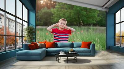 little cheerful boy in nature Wall mural