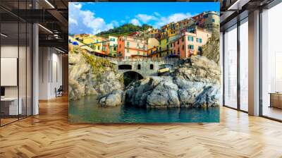 View of Manarola town on rocky coast at famous Cinque Terre National Park. Liguria, Italy Wall mural