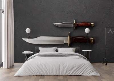 Hunting knives on a black background. Wall mural