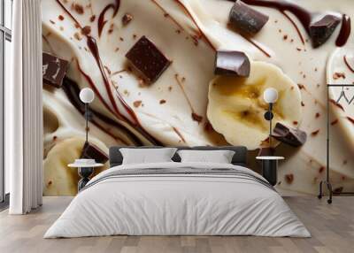 Ice cream with chocolate chunks, banana slices and chocolate syrup Wall mural