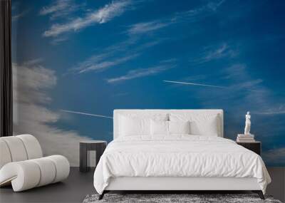 Two planes are flying in the sky on a collision course leaving traces Wall mural