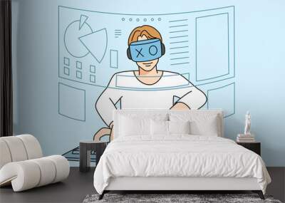 Man in VR glasses play computer games Wall mural