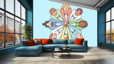 Multiracial people stand in circle with hands outstretched to demonstrate friendship Wall mural