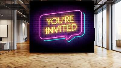 You are invited sign in glowing neon style on a wall. Neon speech bubbles. Vector illustration for marketing or advertisement. Wall mural