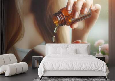 Young woman with Omega 3 fish oil capsules on the windowsill. Wall mural