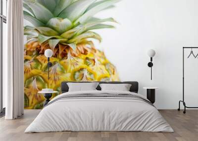 a juicy pineapple on a clean, bright white background. The focus is on the vibrant yellow and green colors and the detailed texture of the pineapple, with even lighting that Wall mural