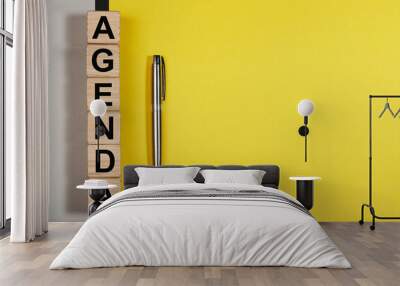 Agenda word on yellow background with copy space for text. Wall mural