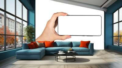 Hand holding phone mockup in horizontal position isolated on white background. Woman using smartphone for watching video. High quality photo Wall mural