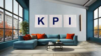 kpi inscription on white stickers on a blue background Wall mural