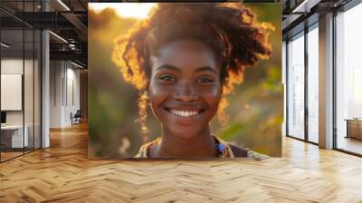 Young lady portrait, happy female adult, black beauty, cheerful and attractive model, afro hair, smiling, fashionable and curly. Closeup expression, outdoors with confident Wall mural