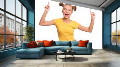 Portrait of funny teen girl enjoying music and dances, isolated on white background. Beautiful caucasian young teenager having fun. Happy cute child in yellow. Wall mural