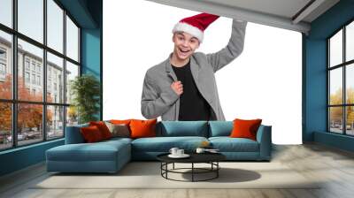 Portrait of teen boy with Christmas hat. Teenager wearing grey suit, smiling and looking at camera. Holiday concept - happy cute child isolated on white background. Wall mural