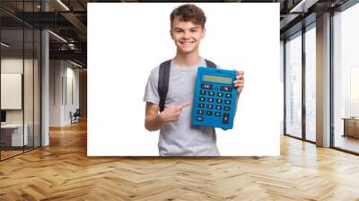 Smart student with backpack holding big calculator. Portrait of funny cute teen boy, isolated on white background. Happy child Back to school. Wall mural