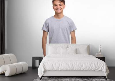 T-shirt design concept. Teen boy in blank gray t-shirt, isolated on white background. Mock up template for print. Happy child looking at camera, front view. Wall mural