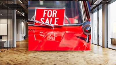 FOR SALE, red sign on classic antique American bright red car hood and chrome parts close up, during outdoor old cars show Wall mural