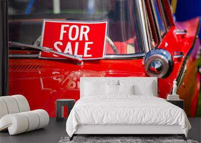 FOR SALE, red sign on classic antique American bright red car windscreen and chrome parts close up, during outdoor old cars show Wall mural