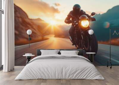 A motorcyclist in a protective red leather suit and helmet rides a sports motorcycle. A biker rides along the road against the backdrop of sunset. Wall mural