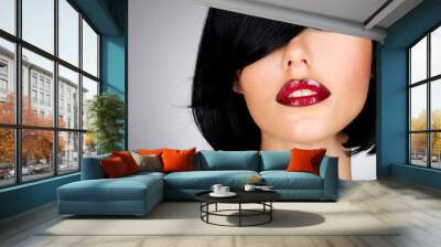 Beautiful brunette woman with shot hairstyle and sexy red lips Wall mural