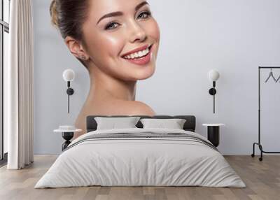 Beautiful face of smiling  woman with clean fresh skin Wall mural