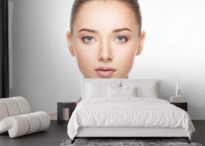 Beautiful face of young woman with healthy clean skin Wall mural