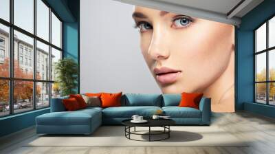 Beautiful face of young woman with perfect skin Wall mural