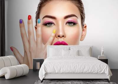 Beautiful fashion woman with a colored nails. Attractive white girl with multicolor manicure. Wall mural