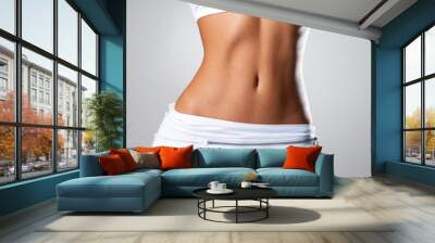 beautiful female slim tanned body Wall mural