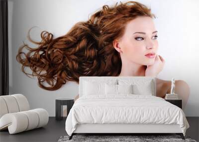 beautiful nice woman with long ringlets hair Wall mural