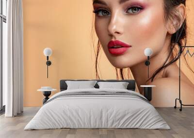 Beautiful white girl with red lips looks to the camera. Stunning brunette girl. Closeup face of young beautiful woman with a healthy clean skin. Pretty woman with bright  makeup of eyes. Wall mural