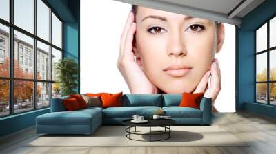 Beautiful woman stroking her clean face Wall mural