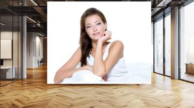 beautiful woman with clean skin sitting on sofa Wall mural