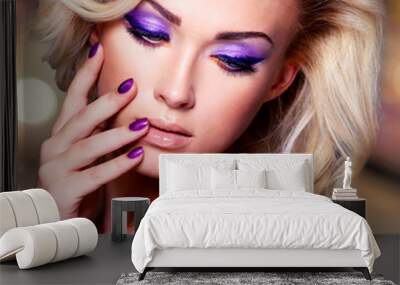 beautiful woman with purple nails and glamour makeup Wall mural