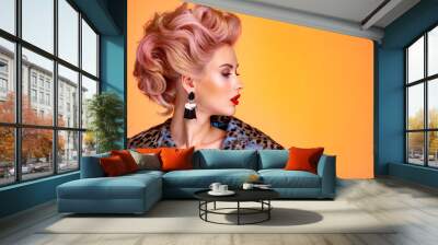 Beautiful woman with style hairstyle. White woman with bright colored makeup. Fashionable young woman is in the spotted fur coat. Stunning blonde girl. Bright eye makeup. Attractive sexy model poses Wall mural