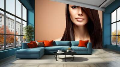 Beautiful young woman with long straight brown hair. Wall mural