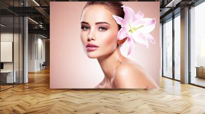 Beauty pure face of the young beautiful girl with flower Wall mural