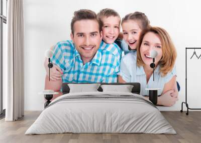 Caucasian happy smiling young family with two children Wall mural