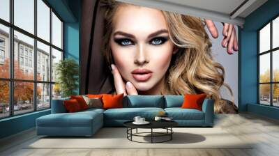 Closeup face of a beautiful girl with  makeup in style smoky eyes. Wall mural